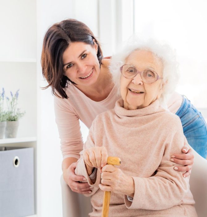 elderly-woman-embraced-by-daughter